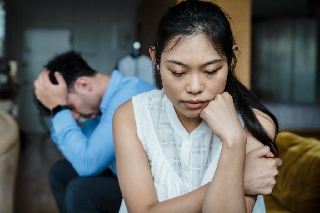Couple experiencing emotional distress and conflict due to in-law problems